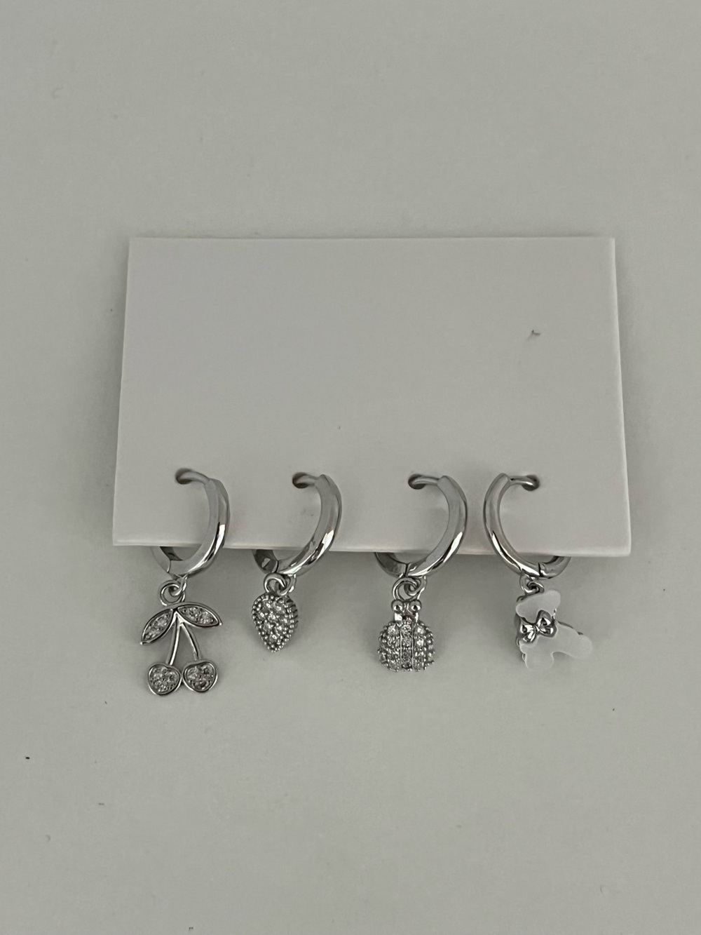 NYU NYU silver huggie charm hoop earrings